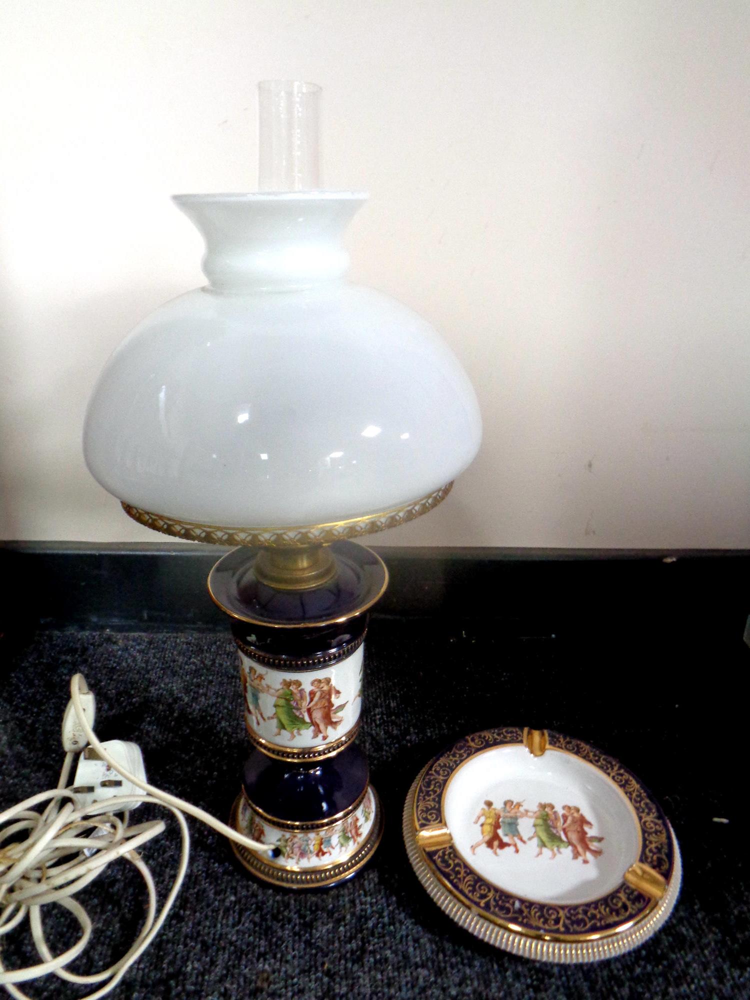 An Italian ceramic lamp with glass shade and matching ashtray