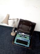 A cased Smith Corona electric typewriter together with an angle poise lamp