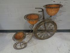 A metal penny farthing planter