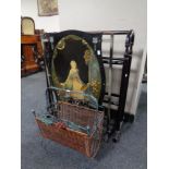 An Edwardian metal fire screen with hand painted wooden panel together with a towel rail and a