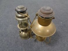 An early 20th century hanging oil lamp together with a further brass ship's hanging oil lamp