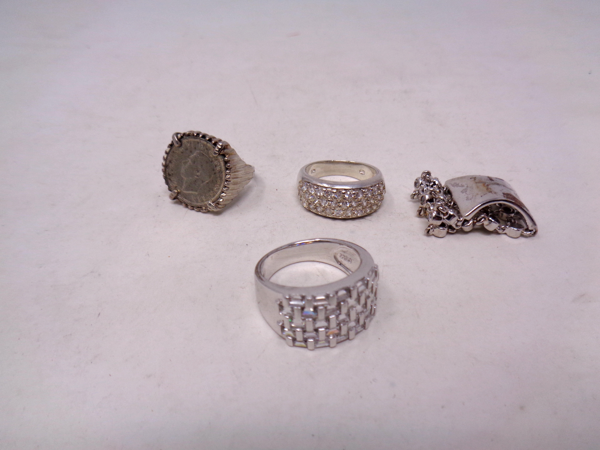 Four silver dress rings (4)