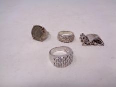 Four silver dress rings (4)