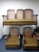 An Edwardian wood framed bergere three piece lounge suite (as found)