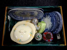 A crate containing antique blue and white meat plates and dinner plates,