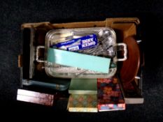 A box containing boxed and unboxed table cutlery, silver plated photo frame,