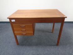 A mid 20th century Scandinavian teak single pedestal desk