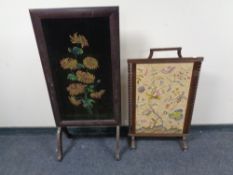 An early 20th century beech tapestry fire screen together with a further fire screen with a hand
