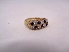 A 9ct gold sapphire and cubic zirconia dress ring