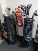 Two golf bags containing irons and drivers to include Paragon,