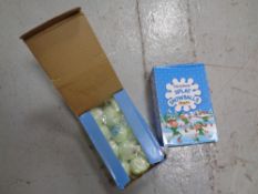 A box containing a large quantity of Christmas splat snowballs