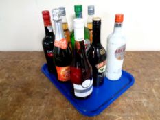 A tray containing nine bottles of alcohol to include Cockburn's Port (75cl),