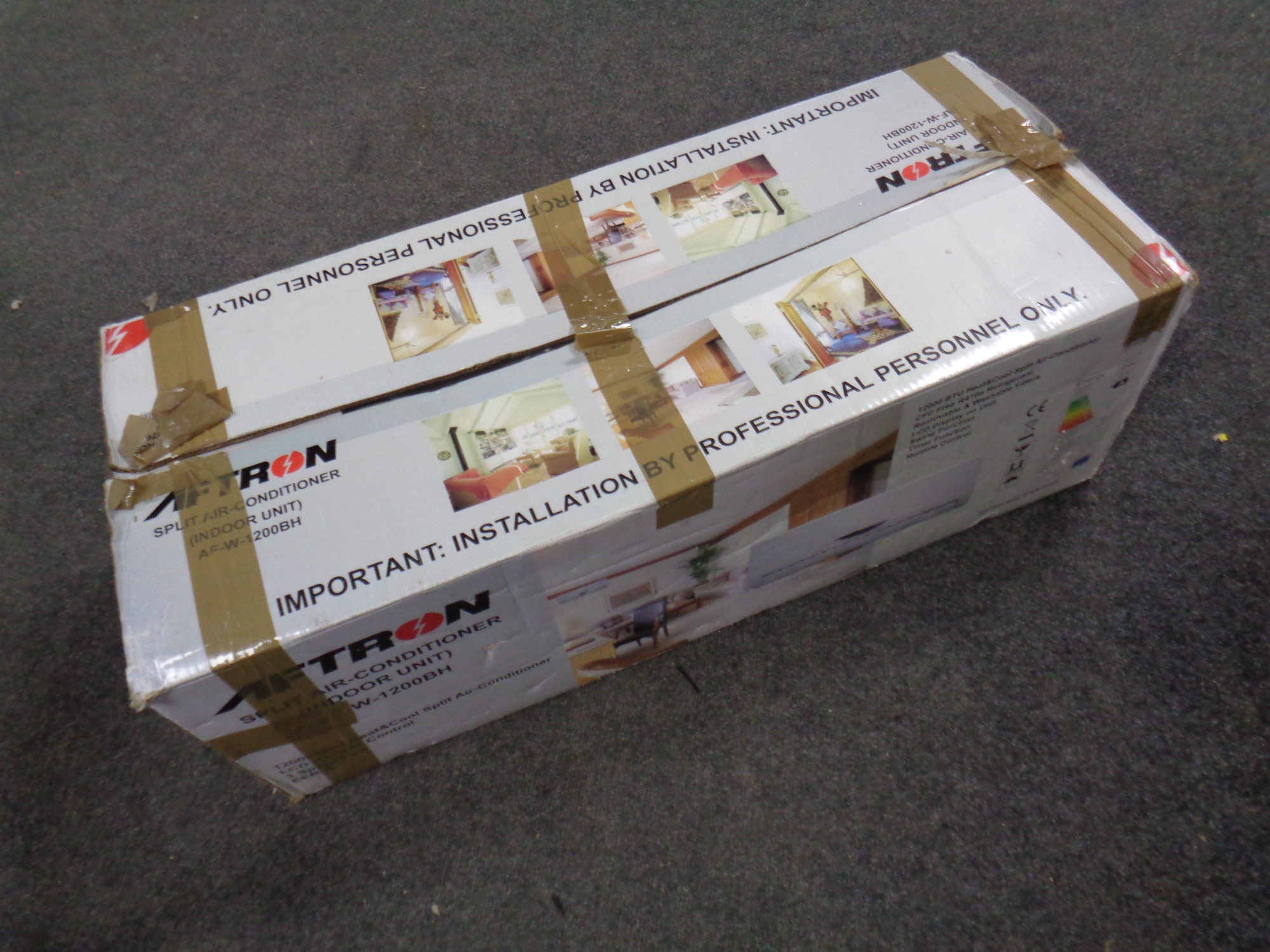 A boxed Aftron Split air conditioning unit