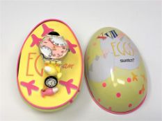 A Swatch Eggs Dream watch in box.