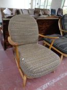 An Ercol solid elm and beech low armchair (as found)