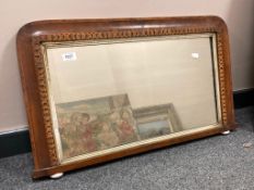 A Victorian inlaid walnut mirror on ceramic feet,