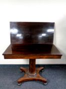 A Regency rosewood turnover top pedestal tea table