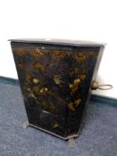 A 19th century toleware twin handled coal bin with floral decoration on raised paw feet