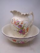 A 19th century floral patterned wash jug and basin