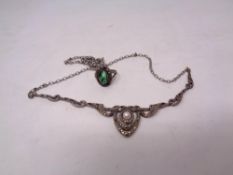 A silver marcasite necklace and ring