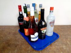 A tray containing nine bottles of alcohol to include Cockburn's Port (75cl),