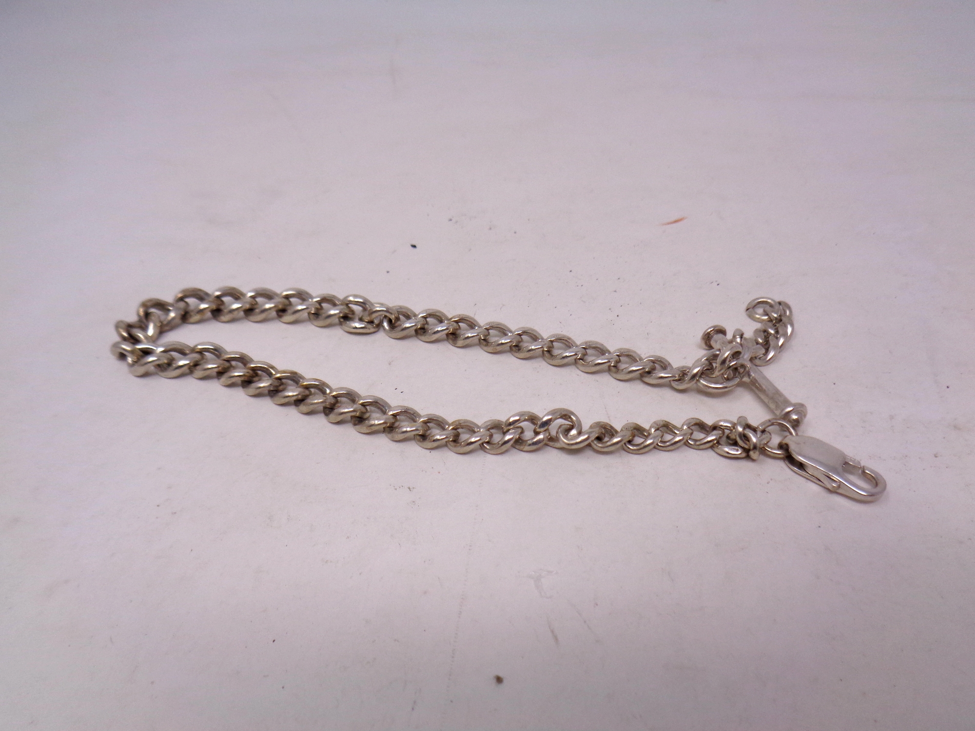 A silver Albert chain with T-bar