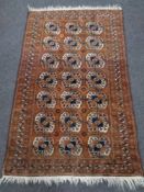 An Afghan Bokhara rug, 162cm by 92cm.