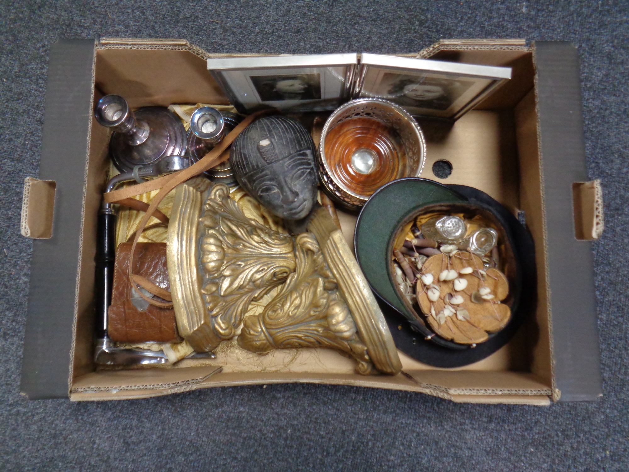 A box containing miscellaneous to include silver plated and oak wine coaster,