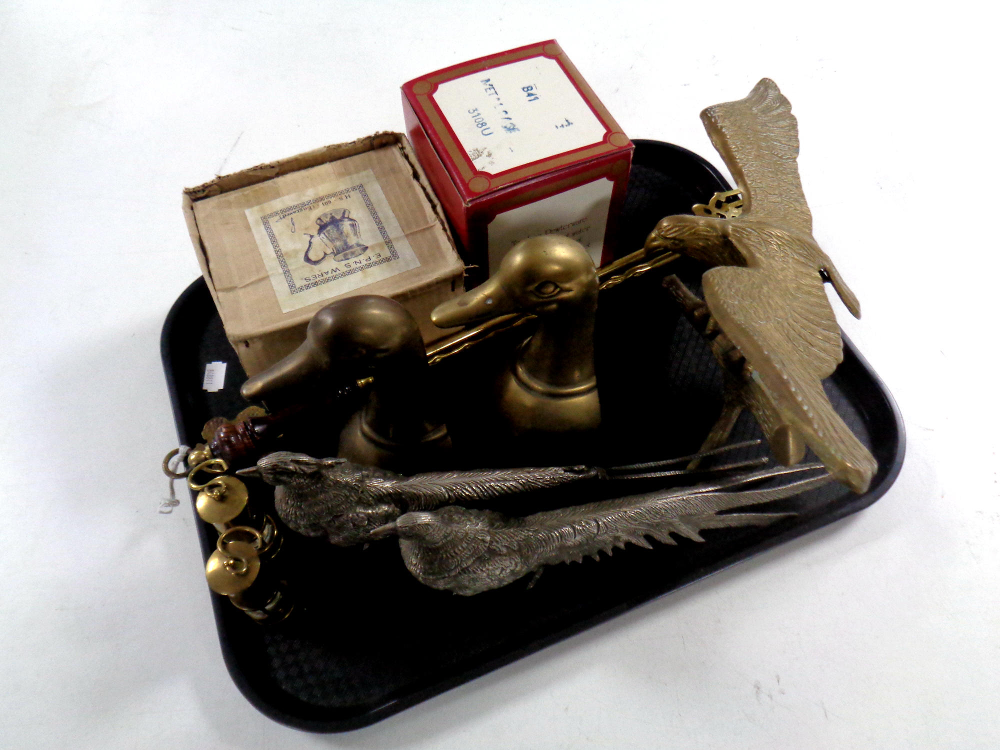 A tray containing antique and later metal wares to include brass figure, eagle, brass duck bookends,