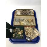 A tray of costume jewellery, compact, gilt metal pieces etc.
