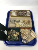 A tray of costume jewellery, compact, gilt metal pieces etc.