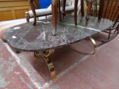 An oval composite marble effect coffee table on brass base