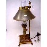 A reproduction brass Orient Express table lamp in the form of an oil lamp