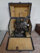 A cased vintage projector