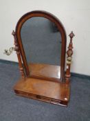 A 19th century mahogany dressing table mirror fitted two drawers with brass candle sconces