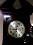 A continental longcase clock with barley twist supports and silvered dial,