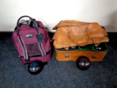 A bowl's bag containing a set of four wooden lawn balls together with a further bowl's bag