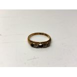An 18ct gold five stone diamond ring, size L. (Central stone missing), 2.