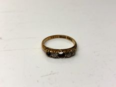 An 18ct gold five stone diamond ring, size L. (Central stone missing), 2.