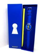 A Swatch Open It watch in box.