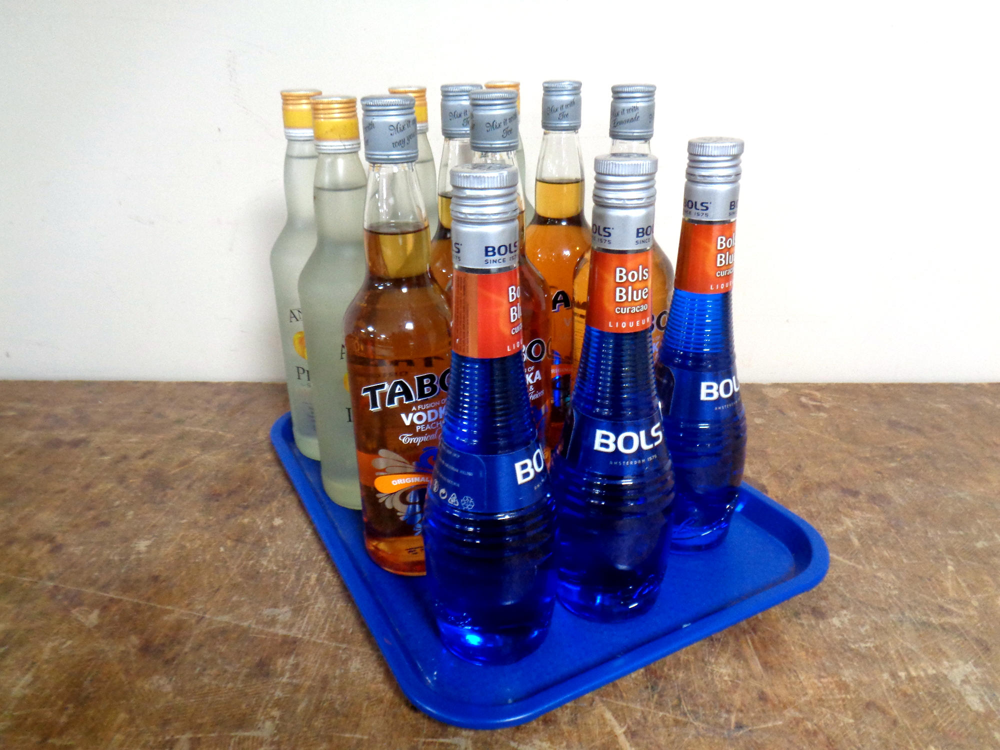 A tray containing twelve bottles of alcohol to include three bottles of Bol's Liqueur (500ml),