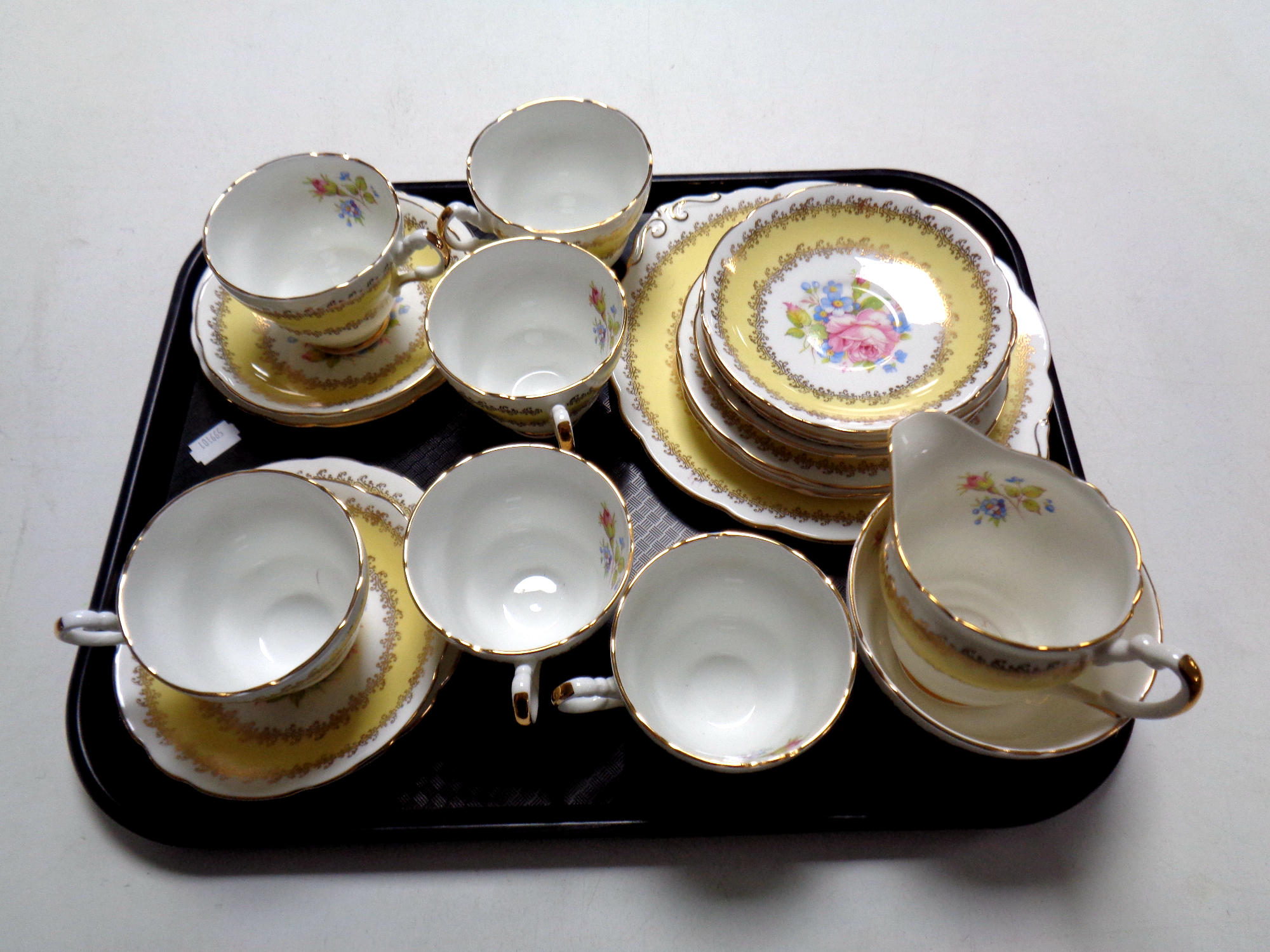 A tray containing a 21 piece Majestic bone china tea service