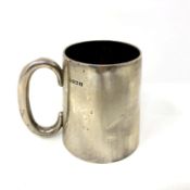 A silver mug, Birmingham 1922. CONDITION REPORT: 169.