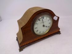 An Edwardian inlaid mahogany mantel clock retailed by Evelyn Bishop Limited of Leeds,