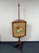 A Victorian mahogany tapestry pole screen