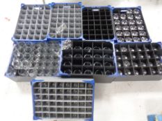 Eight stacking storage crates containing pub glassware to include wine glasses,