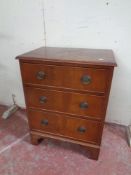 A Georgian style three drawer chest