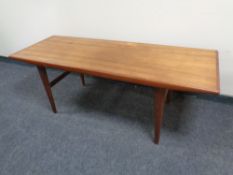 A 20th century Scandinavian teak refectory coffee table with slide