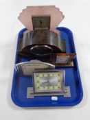 A tray containing five Art Deco desk and mantel clocks