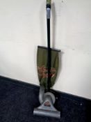 A vintage Gem upright vacuum